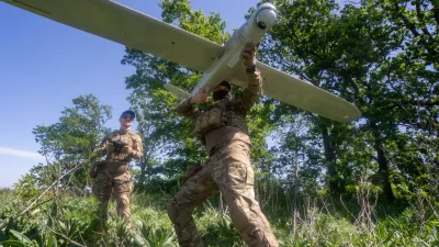 Ukrainian servicemen of Khartia brigade launch a drone towards Russian positions at the front line in the Kharkiv region, Ukraine, Wednesday, May 20, 2026. (AP Photo/Andrii Marienko)