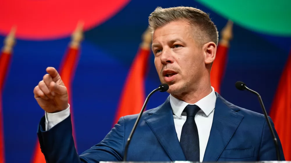 Peter Magyar gestures as he speaks to the media in Budapest, Hungary, Monday, April 13, 2026, after defeating Prime Minister Viktor Orban's party in the country's parliamentary elections. (AP Photo/Denes Erdos)