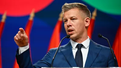 Peter Magyar gestures as he speaks to the media in Budapest, Hungary, Monday, April 13, 2026, after defeating Prime Minister Viktor Orban's party in the country's parliamentary elections. (AP Photo/Denes Erdos)