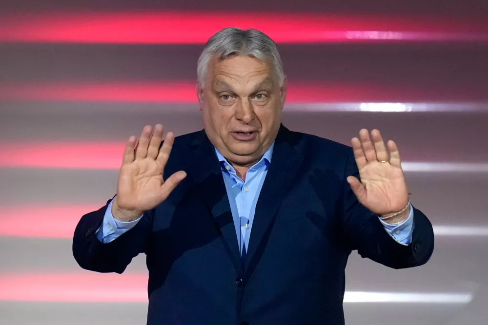 Hungary's Prime Minister Viktor Orban addresses supporters after receiving the results of a parliamentary election in Budapest, Hungary, Sunday, April 12, 2026. (AP Photo/Petr David Josek)