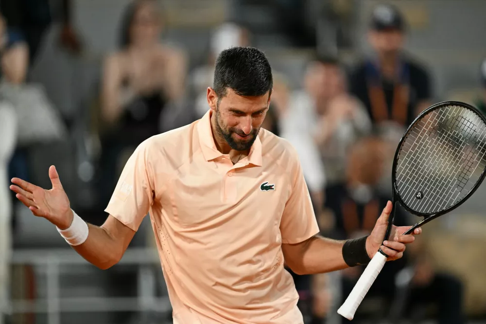 Novak Djokovic of Serbia celebrates after winning the first round men's singles tennis match against against Giovanni Mpetshi Perricard of France at the French Open tennis tournament in Paris, Sunday, May 24, 2026. (AP Photo/Emma Da Silva)