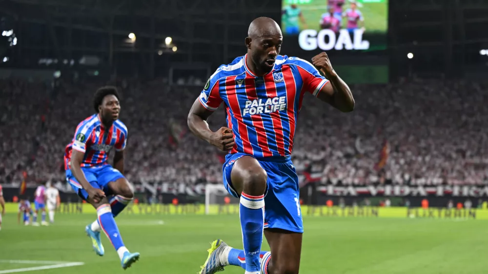 Crystal Palace's Jean-Philippe Mateta celebrates after scoring during the Europa Conference League final soccer match between Crystal Palace and Rayo Vallecano in Leipzig, Germany, Wednesday, May 27, 2026. (Robert Michael/dpa via AP)