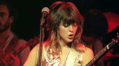 LONDON, UNITED KINGDOM - NOVEMBER 2: Suzi Quatro performs on stage at Hammersmith Odeon on November 2nd, 1978 in London, England. (Photo by Pete Still/Redferns)