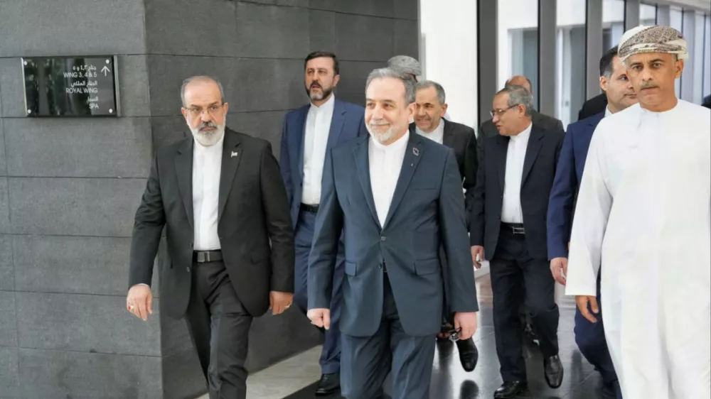 FILE - In this photo released by the Iranian Foreign Ministry, Iranian Foreign Minister Abbas Araghchi, center, heads to the venue for talks between Iran and the U.S., in Muscat, Oman, Friday, Feb. 6, 2026. (Iranian Foreign Ministry via AP, File)
