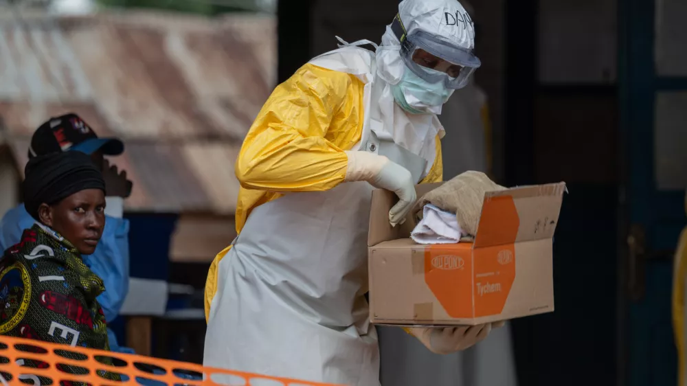 A health worker prepares for duty at the Mongbwalu treatment center in Mongbwalu, Congo, Friday, June 5, 2026. (AP Photo/Moses Sawasawa)