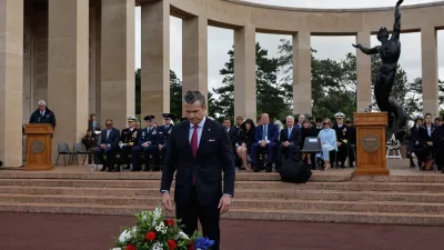 U.S. Defense Secretary Pete Hegseth lays a wreath of flowers during a ceremony at the US cemetery to commemorate the 82nd anniversary of the D-Day landings, in Colleville-sur-Mer, Normandy, France, Saturday, June 6, 2026. (AP Photo/Jeremias Gonzalez)