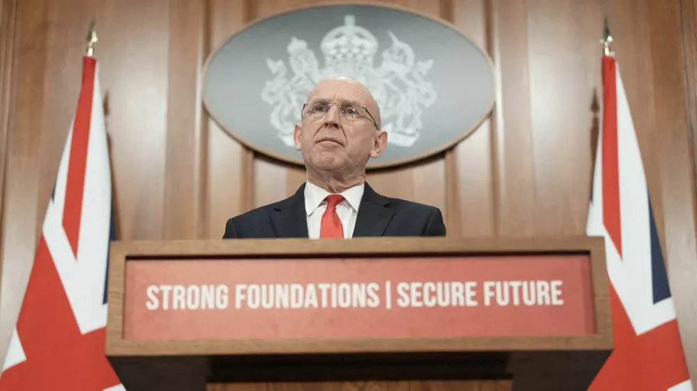 FILE PHOTO: British Defence Secretary John Healey delivers a speech on how the UK's defence industry is delivering growth and national renewal across the UK, at No 9 Downing Street in central London. Picture date: Wednesday November 19, 2025.  Stefan Rousseau/Pool via REUTERS/File Photo