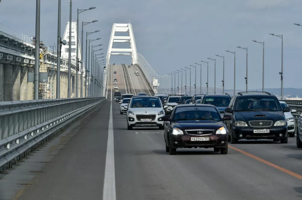 FILE - Cars and other vehicles drive on the Kerch&nbsp;Bridge connecting the Russian mainland and the Crimean&nbsp;Peninsula on&nbsp;Thursday, Feb. 23, 2023. &nbsp;(AP Photo, File)