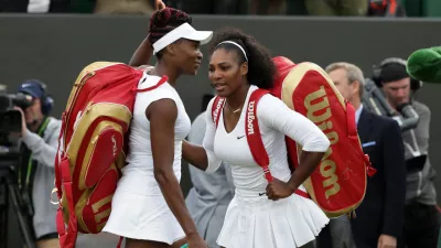 FILE -Serena Williams, right, and her sister Venus of the U.S celebrate after winning their women's doubles match against Andreja Klepac and Katarina Srebotnik of Slovenia on day four of the Wimbledon Tennis Championships in London, June 30, 2016. (AP Photo/Tim Ireland), File)