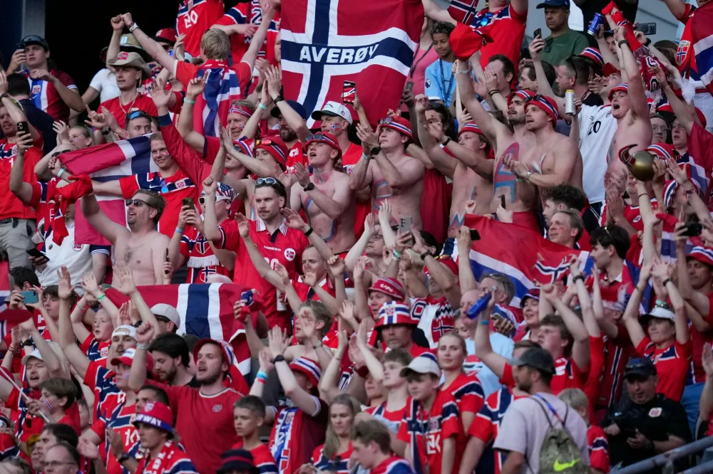 Norway fans cheer for their team at the end of the World Cup Group I soccer match between Iraq and Norway in Foxborough, Mass., near Boston, Tuesday, June 16, 2026. (AP Photo/Charles Krupa)