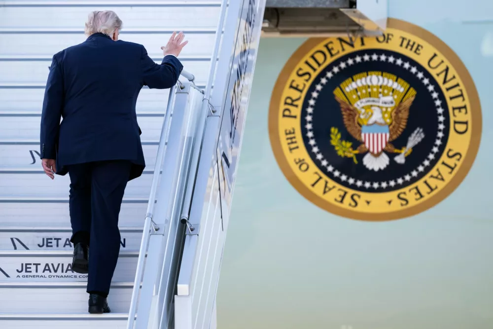 US President Donald Trump boards Air Force One at Geneva Airport, following the G7 summit in nearby Evian-les-Bains, France, in Geneva, Switzerland, Wednesday, June 17, 2026. (Martial Trezzini/Keystone/Pool via AP)