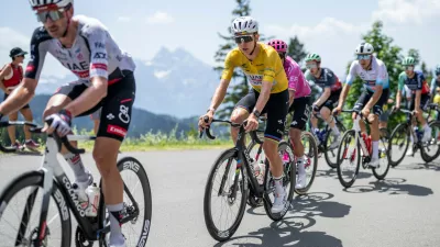 Tadej Pogacar, center, from Slovenia of UAE Team Emirates-XRG competes during the fifth and final stage, a 151 km race with start and finish in Villars-sur-Ollon, Switzerland, at the 89th Tour de Suisse UCI World Tour cycling race, on Sunday, June 21, 2026. (Gian Ehrenzeller/Keystone via AP)