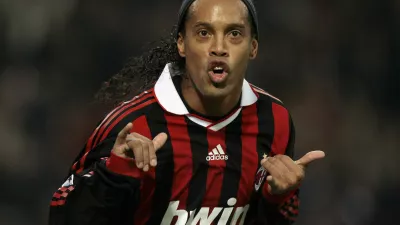 AC Milan's Ronaldinho celebrates after scoring against Real Madrid during their Champions League soccer match at the San Siro stadium in Milan November 3, 2009. REUTERS/Alessandro Garofalo (ITALY SPORT SOCCER)