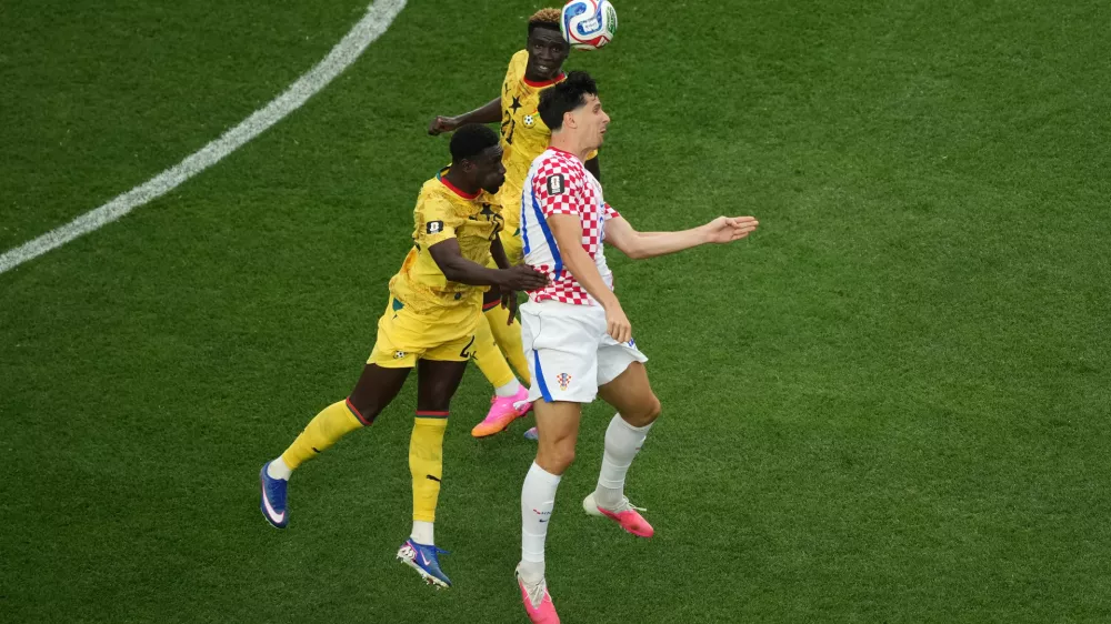 Croatia's Igor Matanovic (20) battles for a header with Ghana's Derrick Luckassen (23) during the World Cup Group L soccer match between Croatia and Ghana in Philadelphia, Saturday, June 27, 2026. (AP Photo/Matt Rourke)