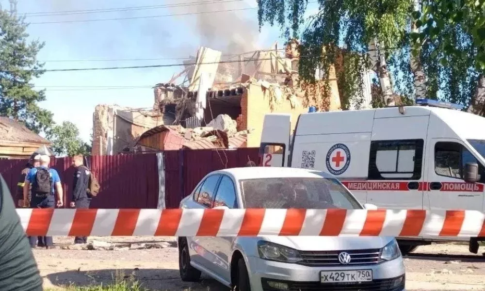 An ambulance stands near a damaged private house following a Ukrainian drone attack, according to regional authorities, in the course of the Russia-Ukraine conflict, in the town of Yegoryevsk, Moscow region, Russia, in this handout image released on June 30, 2026. Governor of Moscow region Andrei Vorobyov/Handout via REUTERS ATTENTION EDITORS - THIS IMAGE WAS PROVIDED BY A THIRD PARTY. NO RESALES. NO ARCHIVES. MANDATORY CREDIT.