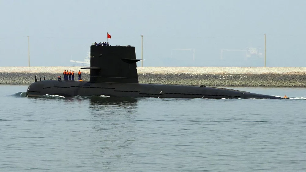 A Chinese navy submarine leaves Qingdao Port, Shandong province April 22, 2009. China will show off its resurgent naval strength this week at a parade marking 60 years since the founding of its navy, presenting its fleet of warships and nuclear submarines as a force for peace, not aggression. REUTERS/Guang Niu/Pool (CHINA POLITICS MILITARY)
