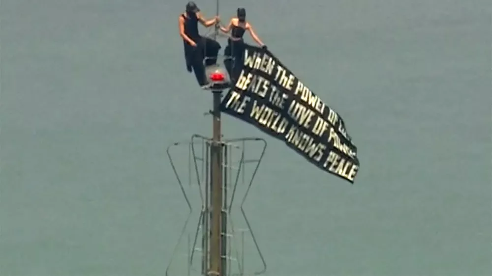 Two people display a banner atop the Empire State Building in the Manhattan borough of New York, U.S., July 1, 2026, in a still image from video. ABC Affiliate WABC via REUTERS. NO RESALES. NO ARCHIVES. THIS IMAGE HAS BEEN SUPPLIED BY A THIRD PARTY