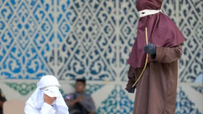 May 21, 2026, Banda Aceh, Aceh, Indonesia: A woman convicted of adultery and adultery was sentenced to 100 lashes in Banda Aceh, Aceh Province, Indonesia, on Thursday. The caning was imposed after she was found guilty of violating Aceh's Sharia law. The public caning served as a lesson and transparency in the implementation of punishment, guaranteed by the Aceh Qanun (Aceh Law), which was passed in 2014. (Credit Image: © Muhammad Iqbal/ZUMA Press Wire)