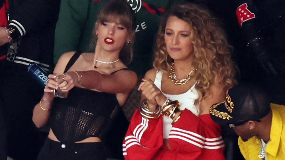 Football - NFL - Super Bowl LVIII - Kansas City Chiefs v San Francisco 49ers - Allegiant Stadium, Las Vegas, Nevada, United States - February 11, 2024 Recording artist Taylor Swift and actor Blake Lively are pictured in the stands before the game REUTERS/Mike Blake