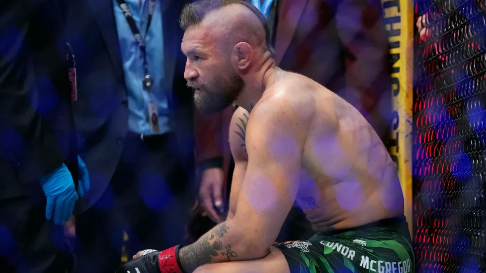 Conor McGregor reacts after losing to Max Holloway in a welterweight fight at the UFC 329 mixed martial arts event Saturday, July 11, 2026, in Las Vegas. (AP Photo/John Locher)