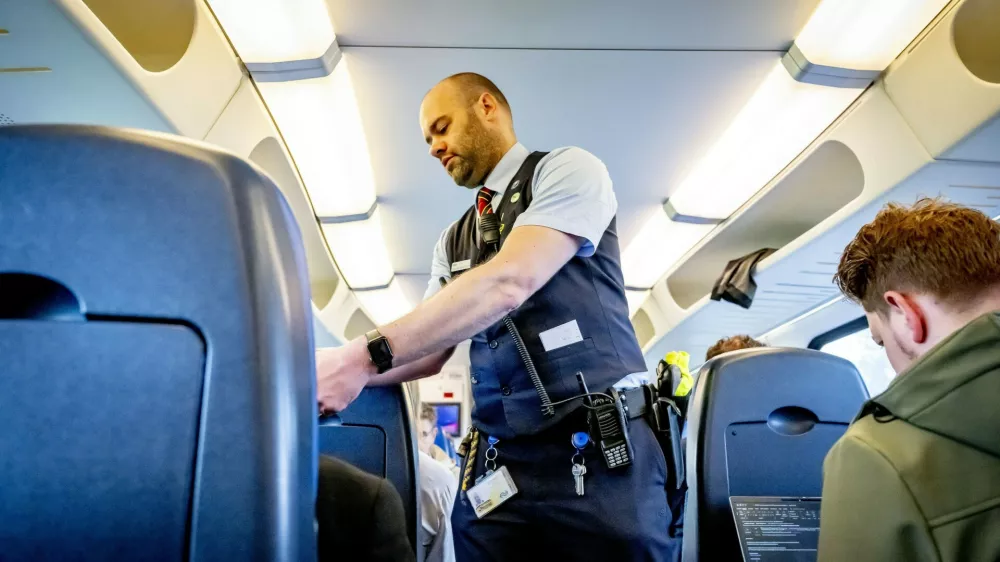 Gouda - An NS chief conductor with a bodycam. NS aims to improve the safety of its colleagues with this measure. Bodycams have a de-escalating effect. And if an incident does occur, camera footage can be used as evidence. All chief conductors will receive a bodycam.Chief Conductors Get Bodycams - 16 Jun 2026,Image: 1110505817, License: Rights-managed, Restrictions:, Model Release: no 