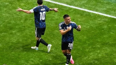 Argentina's Lautaro Martinez (22) and Lionel Messi (10) celebrate after defeating England in the World Cup semifinal soccer match in Atlanta, Wednesday, July 15, 2026. (AP Photo/Lynne Sladky)