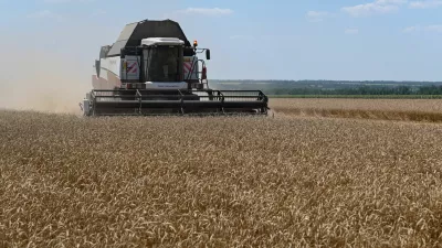 A combine harvests wheat in a field in the Rostov Region, Russia July 14, 2026. REUTERS/Sergey Pivovarov