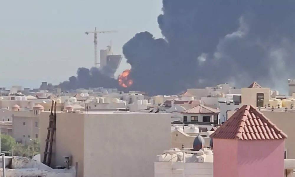 Smoke billows near the oil facility in Mangaf, Kuwait, July 18, 2026, in this screen grab obtained from a social media video. Social Media/via REUTERS THIS IMAGE HAS BEEN SUPPLIED BY A THIRD PARTY. MANDATORY CREDIT. NO RESALES. NO ARCHIVES. NEWS USE ONLY. Verification lines: - Tower, mosque, and buildings matched satellite and archive imagery. - Date verified by statement from Kuwait Petroleum Corporation that one of its oil facilities had been hit in "repeated Iranian attacks," causing significant damage and some injuries, according to the state news agency. - The area where the smoke is shown in the video is marked as a Kuwait Petroleum Company facility on Google maps.