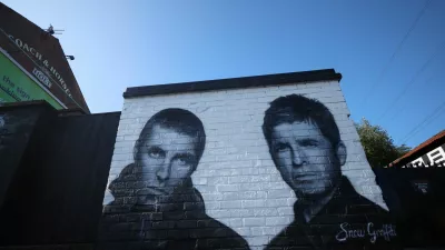 A mural of Oasis band members Liam and Noel Gallagher by artist Snow Graffiti is seen on the wall of the Coach and Horses pub in Whitefield, near Manchester, Britain, August 31, 2024. REUTERS/Phil Noble