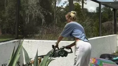 Story from Jam Press (Extreme Allergic Reaction)Pictured: Video Grab: Aleksandra cutting down the agave plants.Mum-of-five suffers extreme allergic reaction after cutting down toxic plants in own gardenA mum-of-five was left covered in an agonising rash within minutes of cutting down agave plants in her garden after toxic sap sprayed onto her skin.Aleksandra Schmidt, 42, had been removing overgrown agave plants around her pool as part of a DIY landscaping project at her home in Florida.She had several agave plants in the garden, with five on each side of the pool, and had decided to remove one row because they had become too large for the space.Aleksandra, who splits her time between the Tampa and Fort Lauderdale areas, said she knew the plants were sharp but had no idea their sap could trigger such a severe reaction.Using a chainsaw after finding her machete wasn't sharp enough, she was showered with agave sap and shards as she cut through the plants.Within minutes, she noticed an intense stinging sensation on her legs.Aleksandra said: "It felt like multiple bee stings."When I looked down, I saw countless reddish-copper spots on my legs."At first, I thought I had somehow cut myself and was bleeding."The itching quickly became unbearable.She ran into her swimming pool before realising the red spots were actually tiny agave shards stuck all over her skin.Aleksandra rushed inside and got into the shower, desperately rubbing the affected areas because it was the only thing that brought any relief.She said: "My legs became extremely irritated and inflamed."What worried me most was that I started getting chills and generally felt very strange."I wasn't sure how severe the reaction might become."It quickly became obvious this was much more than a minor rash or simple skin irritation."Aleksandra suffered redness, burning, itching and chills but, thankfully, did not experience breathing difficulties or anaphylaxis.She applied hydrocortisone cream after showering and believes taking an Allegra tablet earlier that morning for seasonal allergies may also have helped.It gradually disappeared over the following four days without the need for hospital treatment, as reported by NeedToKnow.Now fully recovered, Aleksandra says there is no sign the incident ever happened.She added: "I cut a plant that, unbeknownst to me, could cause a severe reaction."I learned something new and now I know."My biggest takeaway is that many people, like me, may not realise agave sap can cause severe skin reactions, especially when combined with sun exposure."If sharing my experience helps even one person avoid going through the same thing, then it was worth talking about."The video documenting Aleksandra's horrifying reaction, shared Wednesday (27 May) has been viewed more than three million times on social media, with thousands of users sharing their thoughts.One person said: "I had zero knowledge of this. Thank you for spreading awareness."Another wrote: "Hardcore! Gardening can be dangerous."Someone else added: "Thank you for sharing this education. I would have never known."A fourth commented: "Oh my!! That looks terribly painful!! You're brave to post this. You will save someone else pain and misery. I absolutely hate those plants. They're scary looking."However, not everyone was sympathetic.One viewer wrote: "It's the flip flops and sweats pulled to knees while using a chainsaw for me."ENDSEDITOR'S NOTE: Exclusive Licence: An exclusive licence has been obtained directly from the verified copyright holder. Jam Press holds exclusive distribution rights for the agreed content within the terms of the contributor agreement.,Image: 1116795156, License: Rights-managed, Restrictions: EDITOR'S NOTE: Exclusive Licence: An exclusive licence has been obtained directly from the verified copyright holder. Jam Press holds exclusive distribution rights for the agreed content within the terms of the contributor agreement., Model Release: no 