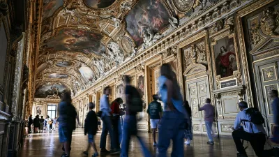 Visitors arrive during the reopening to the public of the Apollo Gallery, where French crown jewels worth 88 million euros were stolen in 2025 in a brazen heist, at the Musée du Louvre in Paris on July 22, 2026.,Image: 1117855123, License: Rights-managed, Restrictions:, Model Release: no 