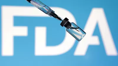 FILE PHOTO: A U.S. Food and Drug Administration (FDA) logo, a syringe and a vial are seen in this illustration taken May 13, 2025. REUTERS/Dado Ruvic/Illustration/File Photo