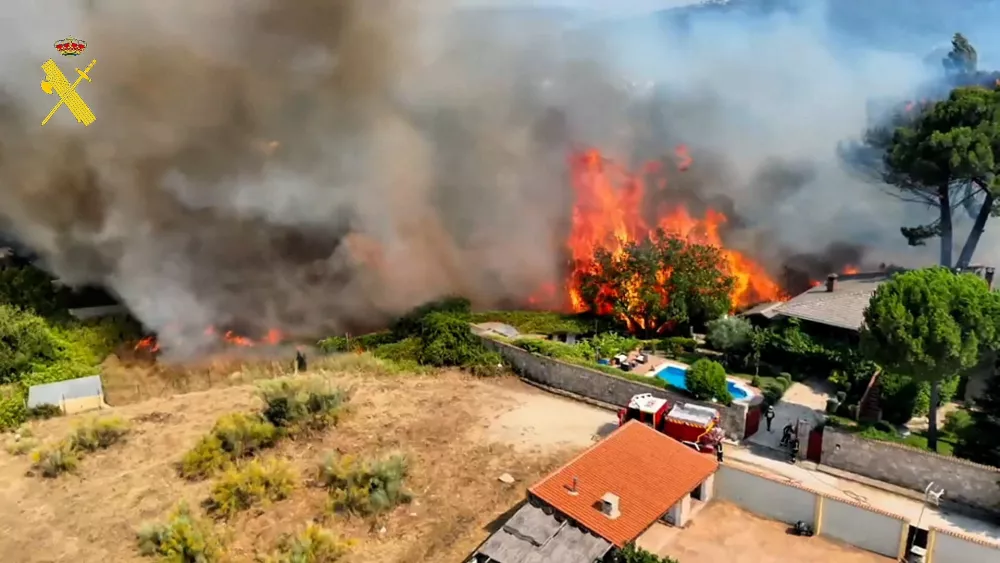Flames and smoke rises during a wildfire in the Madrid region, Spain, July 24, 2026, in a screengrab from video.  Spain's Civil Guard/Handout via REUTERS  THIS IMAGE HAS BEEN SUPPLIED BY A THIRD PARTY. MUST NOT OBSCURE LOGO