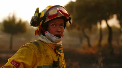 Firefighters battle a wildfire in San Martin de Valdeiglesias, west of Madrid, Spain, Sunday, July 26, 2026. (AP Photo/Manu Fernandez)