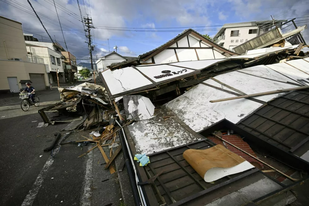 Buildings that collapsed after an earthquake with a magnitude of 7.1 struck Japan's southern Kumamoto prefecture, in Yatsushiro City, Japan, July 29, 2026. Kyodo/via REUTERS ATTENTION EDITORS - THIS IMAGE HAS BEEN SUPPLIED BY A THIRD PARTY. MANDATORY CREDIT. JAPAN OUT. NO COMMERCIAL OR EDITORIAL SALES IN JAPAN.   TPX IMAGES OF THE DAY