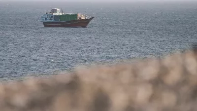 FILE PHOTO: A vessel in the Strait of Hormuz, as seen from Musandam,Oman, July 16, 2026. REUTERS/Stringer/File Photo
