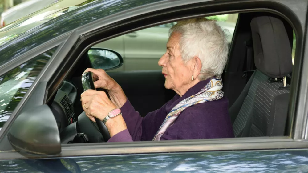 senior woman driving a car