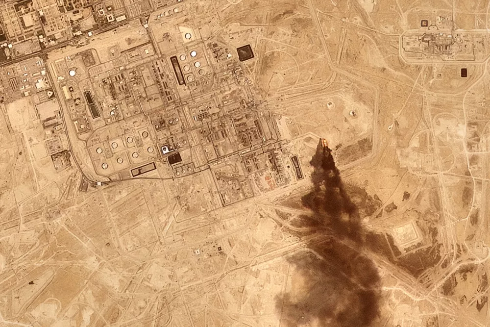 This satellite image provided by Planet Labs PBC on July 27, 2026 shows smoke rising from the Saudi Aramco oil processing facility in Abqaiq, Saudi Arabia, 2026. (Planet Labs PBC via AP)