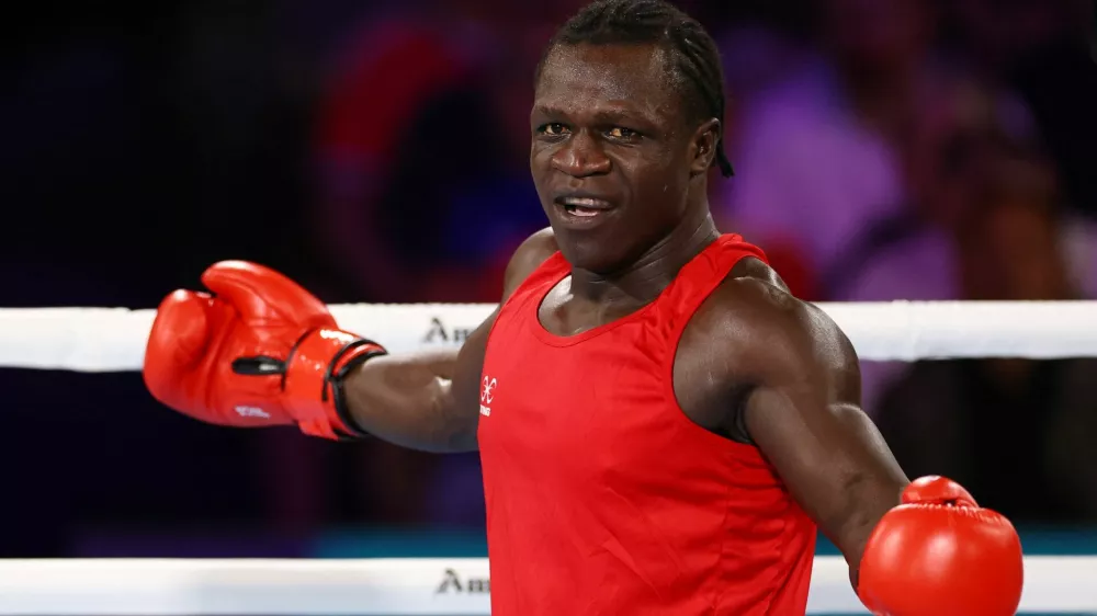Commonwealth Games 2026 - Boxing - SEC Centre, Glasgow, Scotland, Britain - July 29, 2026 Uganda's Aziz Abdul reacts during the men's 90+kg quarter-final 2 against England's Damar Thomas REUTERS/Matthew Childs