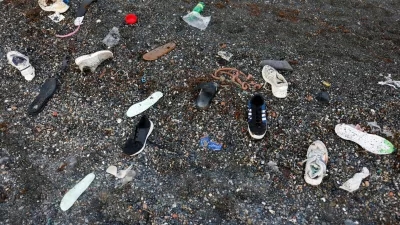 Shoes belonging to migrants lie on El Tarajal beach, amid mass crossings of migrants on foot and by sea from Morocco into Spanish territory, in Ceuta, Spain, July 31, 2026. REUTERS/Jon Nazca