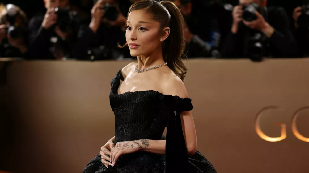 FILE PHOTO: Ariana Grande poses on the red carpet at the 83rd Annual Golden Globes in Beverly Hills, California, U.S., January 11, 2026. REUTERS/Daniel Cole/File Photo