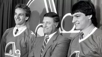 Maurice Filion, director manager of the Quebec Nordiques, welcomes Mario Brunetta, left, and Jason Lafreniere to the team, in Quebec City on June 4, 1986. Filion died Saturday morning at the age of 85.,Image: 343463854, License: Rights-managed, Restrictions: World rights excluding North America, Model Release: no / Foto: Jacques Nadeau Via Profimedia