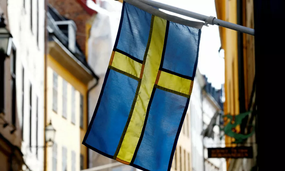 FILE PHOTO: The Swedish flag is seen at Gamla Stan, the Old City of Stockholm, Sweden, May 7, 2017. REUTERS/Ints Kalnins/File Photo