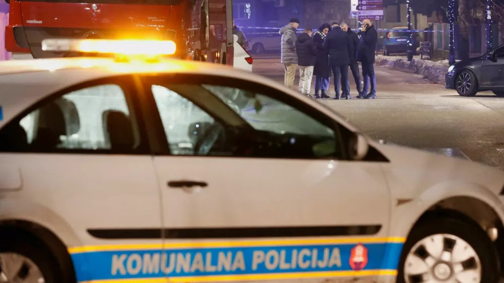 Police and security personnel stand on a street in front of a firetruck near the scene where a gunman opened fire at a restaurant and killed several people in Cetinje, Montenegro, January 1, 2025. REUTERS/Stevo Vasiljevic