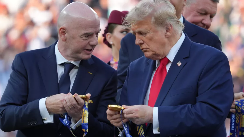 FIFA President Gianni Infantino, left, and President Donald Trump comment on the medals as they wait to congratulate the Spanish players after the World Cup final soccer match between Spain and Argentina in East Rutherford, N.J., near New York, Sunday, July 19, 2026. (AP Photo/Jacquelyn Martin)