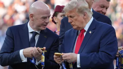 FIFA President Gianni Infantino, left, and President Donald Trump comment on the medals as they wait to congratulate the Spanish players after the World Cup final soccer match between Spain and Argentina in East Rutherford, N.J., near New York, Sunday, July 19, 2026. (AP Photo/Jacquelyn Martin)