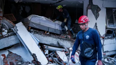 Emergency personnel work at the site of a damaged building after an earthquake, in Cali, Colombia August 10, 2026. REUTERS/Christian EscobarMora   TPX IMAGES OF THE DAY