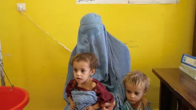 Sadiqa, 30, from Helmand, speaks while with two of her daughters, Sofia and Nazdana, who are suffering from malnutrition, at a clinic in Helmand, Afghanistan, July 14, 2026, in this still image taken from a handout video. WFP/Handout via REUTERS THIS IMAGE HAS BEEN SUPPLIED BY A THIRD PARTY. MANDATORY CREDIT.