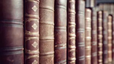 Old leather bound vintage books in a row