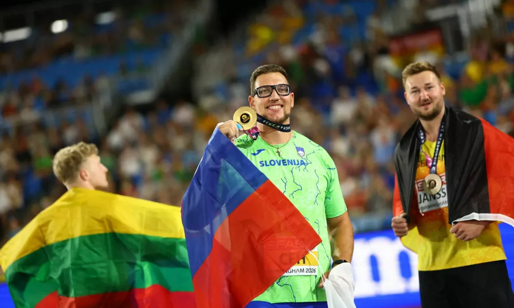 Athletics - European Athletics Championships - Alexander Stadium, Birmingham, Britain - August 13, 2026 Gold medallist Slovenia's Kristjan Ceh celebrates winning the Men's Discus Throw Final with silver medallist Lithuania's Mykolas Alekna and bronze medallist Germany's Henrik Janssen REUTERS/Hannah Mckay